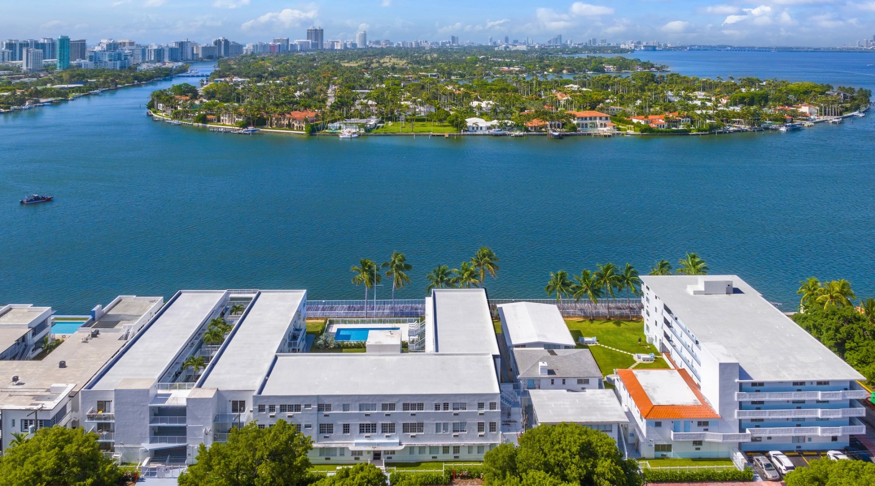 a building near a body of water island and view of a city
