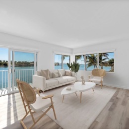living room with couch coffee table and windows